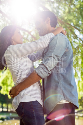 Couple embracing each other in the park