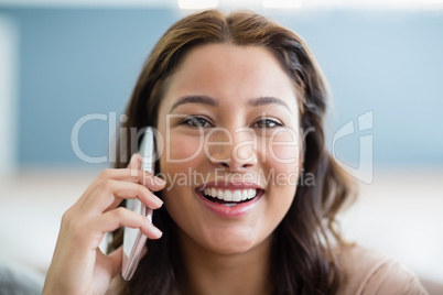 Portrait of smiling woman talking on mobile phone Portrait of smiling woman talking on mobile phone