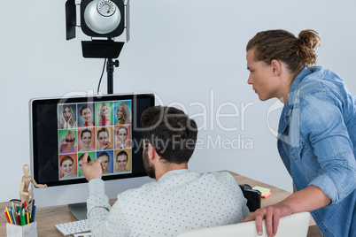 Photographers working at desk