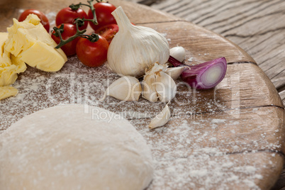 Pizza dough and flour with ingredient
