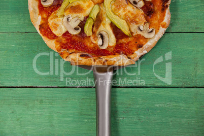 Delicious italian pizza served on pizza peel