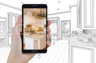 Hand Holding Smart Phone Displaying Photo of Kitchen Drawing Beh