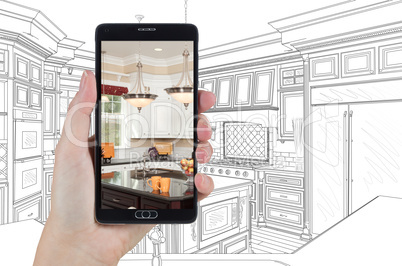 Hand Holding Smart Phone Displaying Photo of Kitchen Drawing Beh