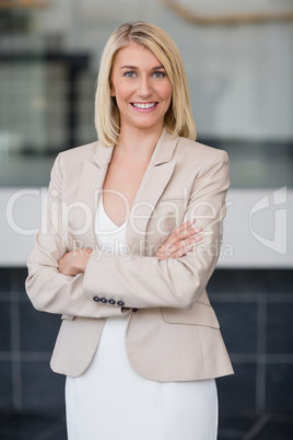 Happy businesswoman standing in conference centre