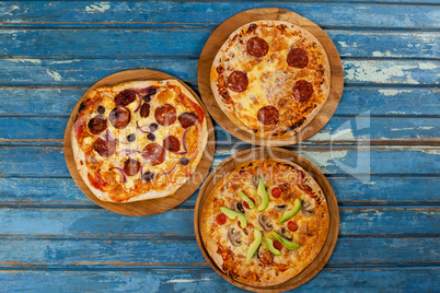 Various delicious italian pizza served on pizza tray