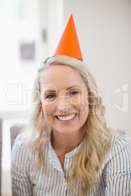 Smiling beautiful woman with party hat