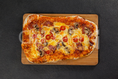 Delicious italian pizza served on wooden board