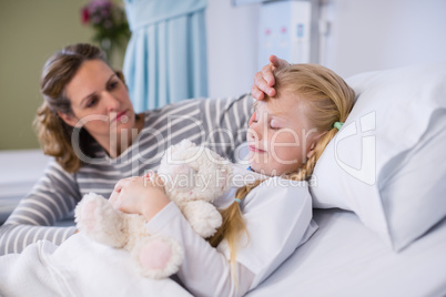 Mother comforting her daughter