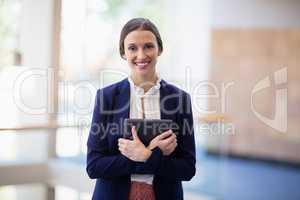 Businesswoman holding digital tablet