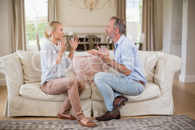 Couple having an argument in living room