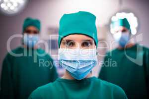 Portrait of female surgeon standing in a operating room