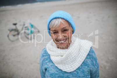 Portrait of senior woman standing on the beach