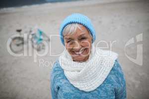 Portrait of senior woman standing on the beach