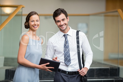 Business executives holding a digital tablet