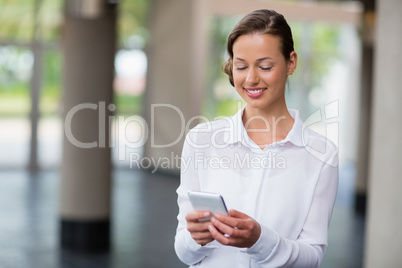 Businesswoman using mobile phone