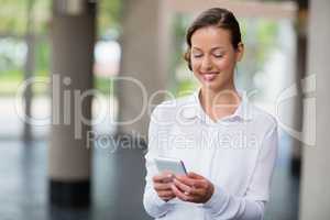 Businesswoman using mobile phone