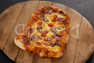 Delicious italian pizza served on wooden board