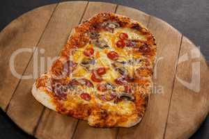 Delicious italian pizza served on wooden board