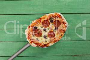 Delicious italian pizza served on pizza peel