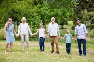 Multi-generation family enjoying together in park