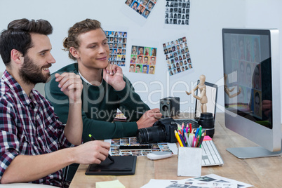 Photographers working at desk