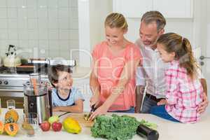 Happy family preparing a food in kitchen