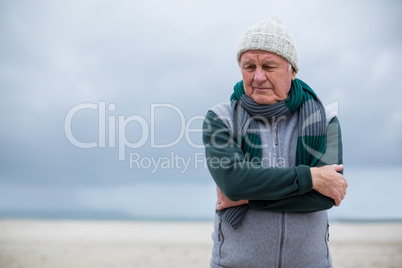 Senior man standing on the beach