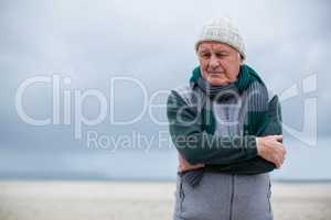 Senior man standing on the beach