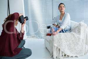 Female model posing for photographer