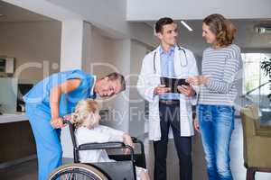 Doctor discussing medical report with mother