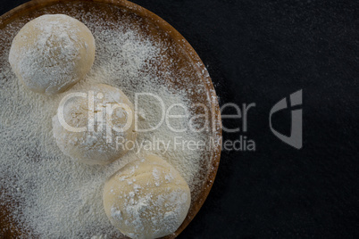 Pizza dough ball on a rolling board