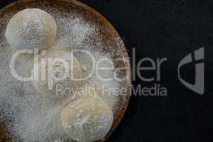 Pizza dough ball on a rolling board