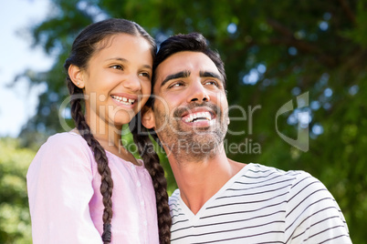 Father having fun with his daughter in park