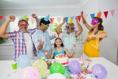 Happy multigeneration family celebrating birthday party