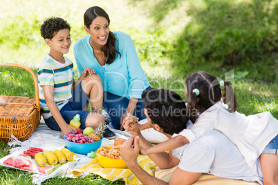 Happy family enjoying together in a park