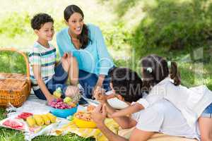 Happy family enjoying together in a park