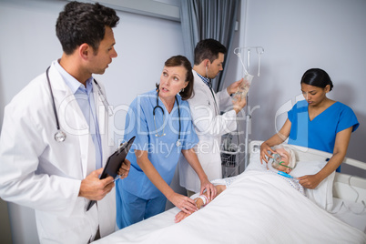 Doctors examining senior patient