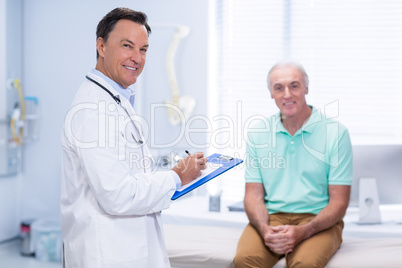 Portrait of smiling doctor and senior patient