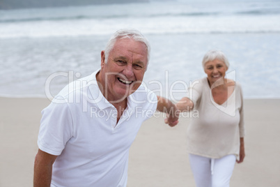 Senior couple having fun together at beach