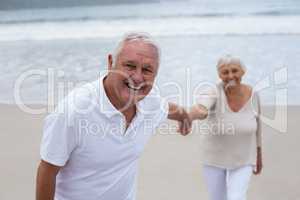 Senior couple having fun together at beach