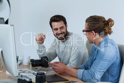 Photographers working together at the desk