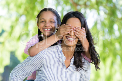 Daughter and mother having fun in park
