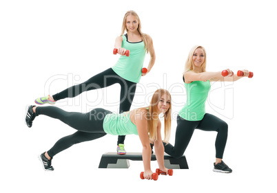 Slim sportswomen in tops and leggings pose in studio