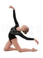 Young slim gymnast in gracefull pose studio shot