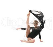 Young pretty gymnast with black cloth studio shot