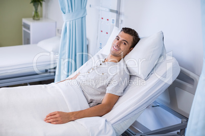 Portrait of patient lying on bed in a hospital