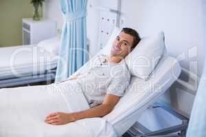 Portrait of patient lying on bed in a hospital