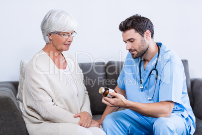 Doctor prescribing medicines to senior woman
