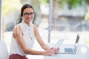 Beautiful woman holding digital tablet