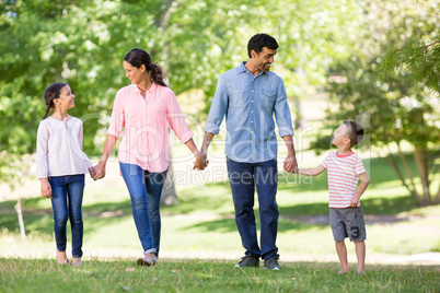 Happy family enjoying together in park Happy family enjoying together in park
